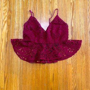 Cute lace crop top with crisscross straps.